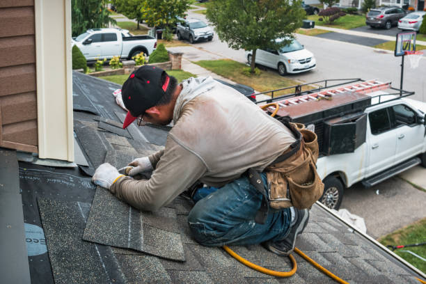 Professional Roofing technician working in Dupont, CO